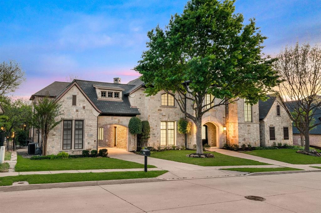 Set on an expansive 0.62-acre creek lot, this beautifully updated estate offers privacy, mature trees, and serene views. Step inside to a bright foyer that opens to elegant formal living and dining spaces with abundant natural light, plantation shutters, and refined finishes. The study features custom built-ins, detailed wall molding, and its own fireplace. The redesigned kitchen is a standout with an oversized island, Viking appliances including double ovens, farmhouse sink, pot filler, and coffee bar with wine fridge. It flows seamlessly into the spacious family room with fireplace and backyard views. The primary suite overlooks the backyard and features a fully remodeled spa-like bath with dual vanities, soaking tub within a large walk-in shower, and custom closet. Upstairs offers versatile living with a game room, built-in desk area, and media room complete with bar, fridge, and projector setup. Secondary bedrooms include en-suite baths, while one features balcony access with peaceful views. Outdoor living is exceptional with a large covered patio, built-in kitchen, and a resort-style pool and spa with water feature. The backyard backs to a creek and green space, creating a rare, tranquil setting. Extensive 2025–2026 updates include HVAC systems, water heaters, kitchen redesign, remodeled baths, new flooring, fresh paint, landscaping, and more. Located in the prestigious, gated Starwood community, residents enjoy 24-hour security, tennis courts, community pool, clubhouse, scenic trails and greenbelts, all minutes from the Dallas North Tollway, The Star, Legacy West, and Frisco’s premier dining, shopping, and entertainment.