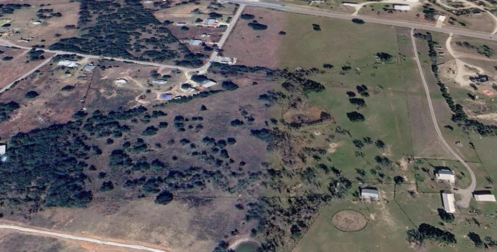 Third Lot on the right.  Lot can be included with the purchase of the house.  Lot can also be bought with the rest of the 55-acre property as a package deal.  
Discover the perfect blend of country living and convenience on this 12.725-acre Ag-exempt tract in Stephenville, the Cowboy Capital of the World. Featuring level, usable terrain with quality native grasses, this property is ideal for horses, livestock, or building your dream ranchette. Mature hardwood trees provide natural shade, while frontage along US Highway 67 offers excellent accessibility for trailers, equipment, and daily commuting. Electricity is available on-site, making development more convenient. 
Located just 5 miles from downtown Stephenville and Tarleton State University, you'll enjoy easy access to shopping, dining, veterinary services, feed stores, and the area's renowned equestrian and rodeo community. Whether you're planning a custom home, barndominium, horse property, or weekend retreat, this versatile acreage offers endless possibilities.