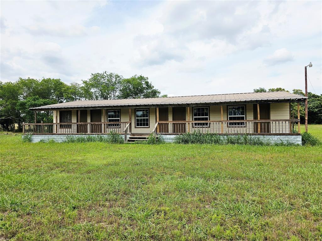 Bring your vision — and maybe a good contractor playlist — to this unique 5-unit studio apartment building featuring a charming covered front porch and situated on 1.15 acres! Whether you’re looking to renovate, invest, or create the next “everyone wants to live there” property, this one offers plenty of potential, personality, and room to make it your own.