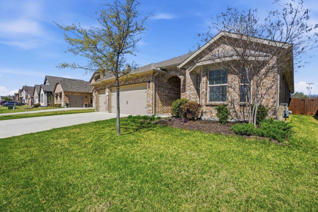 Beautiful well-maintained single story home with 4 bedrooms, 2 bathrooms, and a 3-car garage located in desirable Northwest Fort Worth. This open-concept floor plan features a spacious living, dining, and kitchen area ideal for entertaining and everyday living. The kitchen offers a large seating island, breakfast bar, Corian  countertops, tiled backsplash, gas range and walk-in pantry. The private primary suite includes a dual-sink vanity, and a generous walk-in closet. Additional upgrades include smart home technology, gas tankless water heater, covered patio, fully fenced 6-foot backyard, and landscaped yard with sprinkler system. Community amenities include a resort-style pool, splash pad, playground, and event space. Convenient access to U.S. 287 provides easy commute- approximately 22 minutes to Decatur and 25 minutes to downtown Fort Worth. Zoned to Northwest ISD with Carter Elementary School just two blocks away and Truett Wilson Middle School within walking distance. Move in ready and a great opportunity to own in a growing community.
