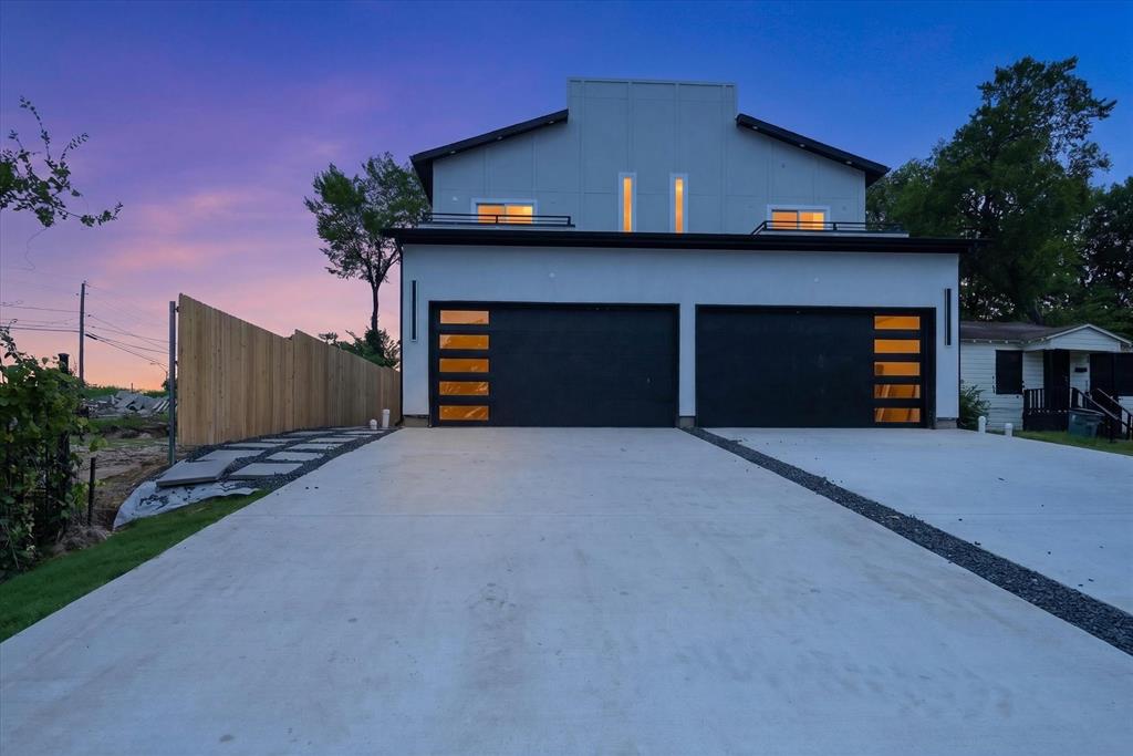520 Woodbine- New Construction Luxury Duplex - No HOA-  Morrell DART Station— 6 Min Walk. 1 Min Drive
(Seller will consider package pricing for purchase of both residences)
Rare opportunity to own a stunning new construction duplex in one of Dallas's most exciting and transit-connected neighborhoods. Two nearly identical units, each approximately 1,935 sq ft (appx. 3,870 sq ft total), each delivering 3 bedrooms with private ensuite baths and finish levels that rival the finest single-family homes on the market.
Each unit features two spacious upstairs bedrooms, both with large walk-in closets loaded with built-in shelving. One upstairs bedroom in each unit opens directly onto its own private balcony showcasing Dallas skyline views. The two bedrooms are so equally impressive that choosing a master is genuinely difficult. A third bedroom on the main level with its own ensuite bath provides ideal flexibility for guests, a home office, or multi-generational living.
The two units are distinguished by their cabinetry — one showcasing dramatic matte black shaker cabinets, the other warm espresso brown
Unlike most urban properties near transit, each unit boasts its own private 2-car garage plus an extended driveway — a rare and highly desirable feature that commands premium rents and eliminates one of the most common tenant pain points in urban Dallas.
The Investment Opportunity 
No HOA means no restrictions and no fees eating into your returns. New construction means zero deferred maintenance and nothing but turnkey, move-in-ready luxury. Live in one unit and let the other generate income, or lease both for maximum cash flow. With premium finishes that command top-of-market rents, a private garage and extended driveway per unit, a DART station literally one minute away, and proximity to some of Dallas's most desirable dining and entertainment destinations, the income potential here is exceptional. This is the kind of asset that performs from day one — don't miss it.