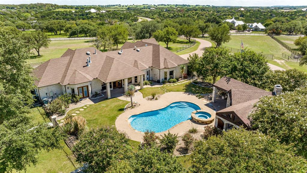 Aesthetic masterpiece on 12.42 acres in the wildly popular gated community of Silverado on the Brazos. This is a
must see for scrupulous buyers looking for space away from busy town life. The property features gated entrance, aggregate concrete driveway, open concept 4BR, 3303’ custom rock home, five stall barn with covered runs, round pen, outdoor arena, pool, hot tub, oversized luxurious outdoor entertaining space, exterior lighting, extensive landscaping, and much more. This is a truly special piece of ground located in one of the hottest areas in Texas!!