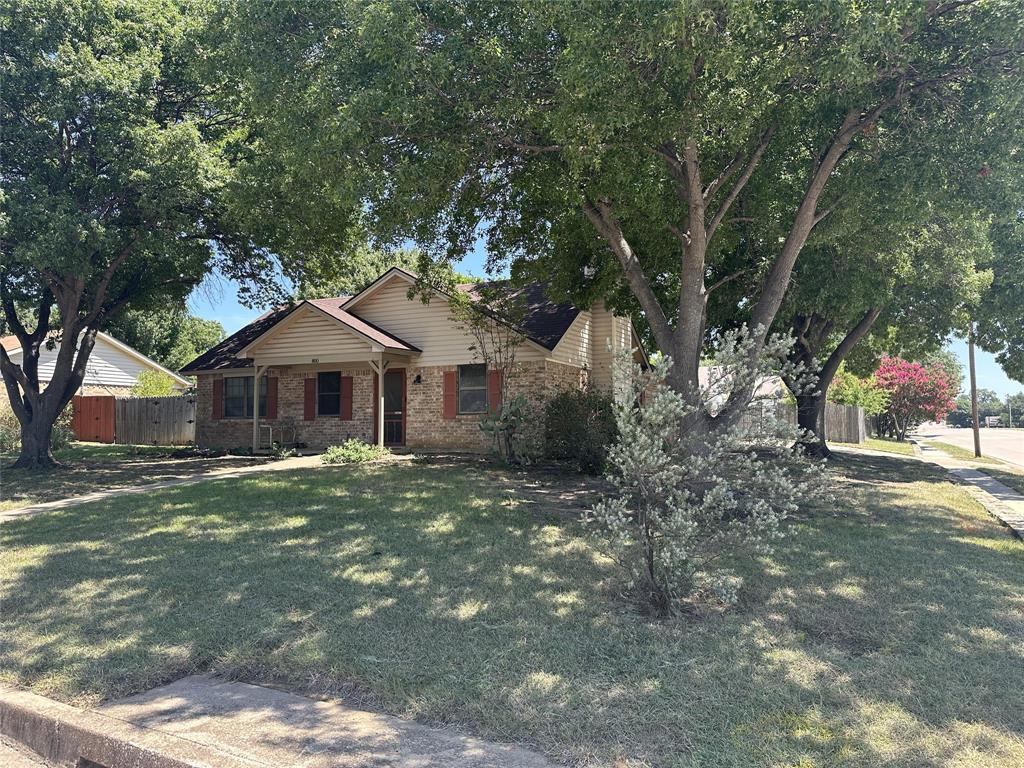 Welcome home to this charming, well-maintained 3 bedroom, 1.5 bath home nestled on a beautiful corner lot in the heart of it all! Perfect for first-time homebuyers or those looking to downsize, this cozy home offers comfort, functionality, and a location that's hard to beat. Step inside to discover a warm and inviting living area featuring a wood-burning fireplace, ideal for relaxing evenings. The versatile second living space provides endless possibilities such as a game room, TV room, home office, craft room, or playroom to suit your lifestyle. The kitchen is designed for both convenience and connection, featuring a pass-through opening to the dining area that makes entertaining and everyday living a breeze. The primary bedroom includes a walk-in closet with built-in shelves and drawers for exceptional organization, while the utility closet offers additional storage space to help keep everything in its place. The tankless water heater adds modern efficiency. Outside, you'll enjoy a fully fenced backyard shaded by mature trees, complete with a greenhouse for gardening enthusiasts and a storage shed for tools and seasonal items. A sprinkler system helps to keep the landscaping looking its best, and rain gutters are located on a portion of the home. Conveniently located near the BRiCk (Burleson Recreation Center), shopping, dining, and schools, this home combines comfort, practicality, and an unbeatable location. Recent updates include newer roof, AC, and disposal. Don't miss the opportunity to make this inviting property your own!