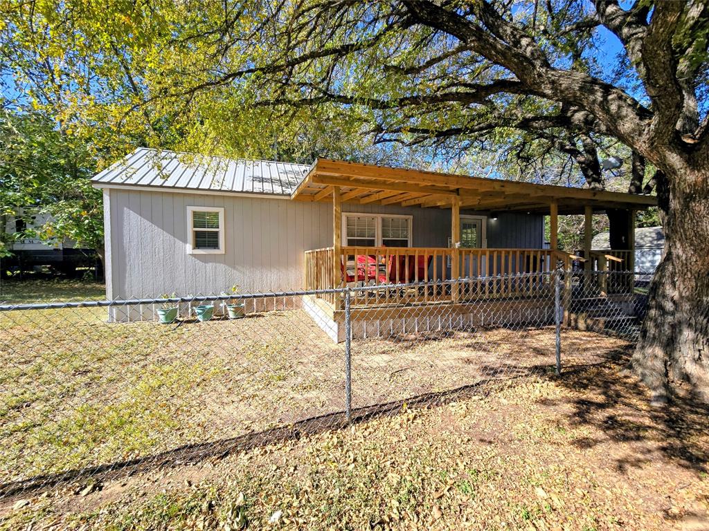 Welcome home, y’all! Nestled in the peaceful community of Indian Harbor, this charming one-bedroom getaway sits on three fully fenced lots, offering plenty of elbow room and a whole lot of charm.

Step onto the wide, covered front deck—the perfect place to sip your morning coffee, watch the birds glide by, or simply soak up the quiet shade of the beautiful, mature tree out front.

Inside, you’ll find a simple yet cozy living space that feels just right for full-time living or a weekend retreat. Whether you're looking for a sweet starter home, a downsized haven, or a serene escape, this property is ready to welcome you with open arms.

Don’t miss this little Texas treasure!