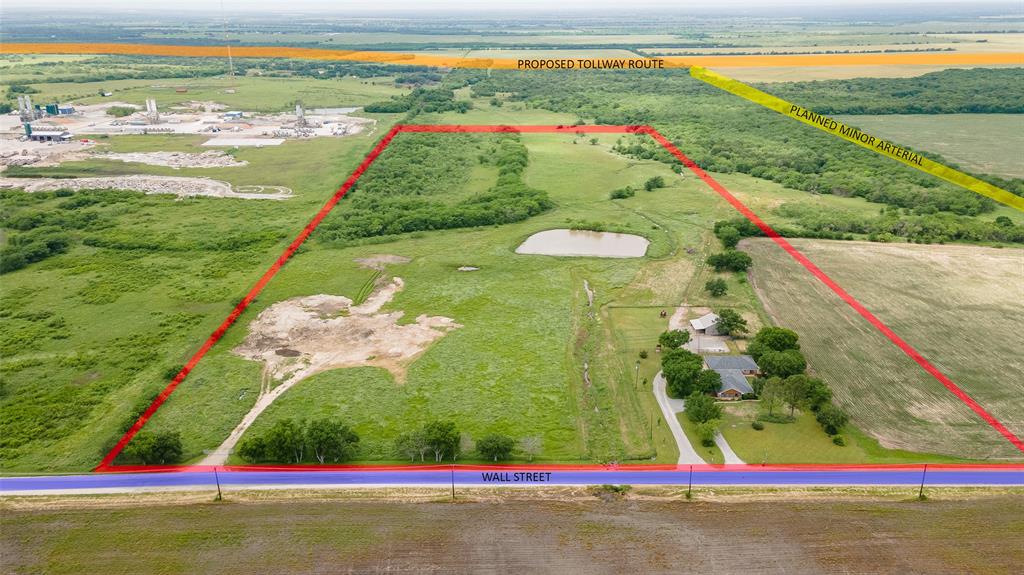 40 acres of Prime Property on Wall Street Road in Gunter about 1 mile from the Recommended Preferred Alignment of the  Grayson County Tollway.  Currently in Residential Agricultural in the Gunter ETJ. Any development plans or changes in zoning need to be approved by City of Gunter and Grayson County.  Currently has a 3 bedroom 2 bath home with recent roof, gorgeous landscaping and a detached garage that has a large office on the North side. Fencing, a barn, and a pond all contribute to a simply beautiful property with potential to become a great investment for future commercial or residential development.