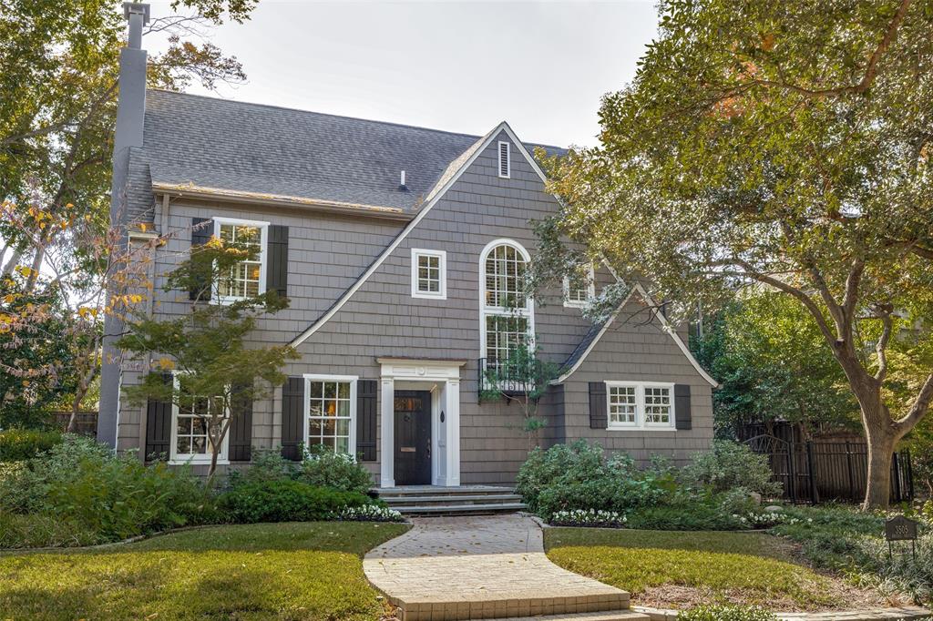 Classic New England Cape Cod–style home originally designed by Fooshee & Cheek. Beautifully updated while honoring its historic character, this five-bedroom, four-and-a-half-bath residence offers an ideal balance of timeless elegance and modern livability. The main level features formal living and dining rooms, a private study, and a warm, inviting family room perfect for everyday living and entertaining. The updated kitchen showcases white marble countertops, stainless steel appliances, and picturesque views of the pool.
The primary suite is located on the second floor and offers serene treetop views. Two additional bedrooms with en-suite baths complete the second level. The third floor includes two bedrooms and a full bath, with one bedroom easily adaptable as flexible space for a gym, playroom, or media room.
Outdoors, the private backyard features a sparkling pool, guest quarters, multiple seating areas, grassy play space, and a detached two-car garage with alley access. Ideally located within walking distance to Armstrong Elementary, McCullough Middle School, and Highland Park Village.
