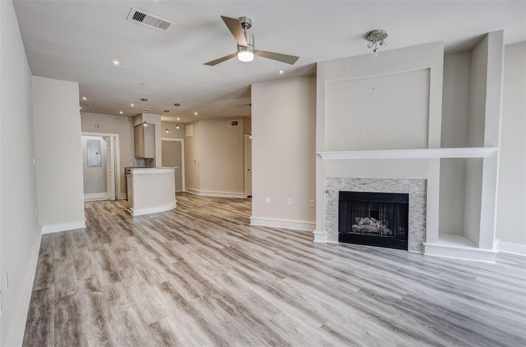 Amazing location and a slick city lifestyle is in the heart of the downtown cultural district across from Kimball Art Museum and adjacent to UNT Medical Center and the newly built Crescent Hotel and Spa. Close by is Dickey's Arena and the dynamic 7th Street. No need to drive anywhere to explore.  All excitements are within your reach. Not feel like going out? Enjoy the night relaxing or entertaining at home in this gorgeous, updated open concept condo with the modern flair, stone fireplace, granite countertops, stainless steel appliances, decorative lighting, walk-in closet, full-size washer and dryer and beautiful balcony. This updated building has a common elevator, staircase, and gated garage with assigned parking space and only a short walk to parks, restaurants, museums, shops, and much more!  New AC Unit installed in 2025.
