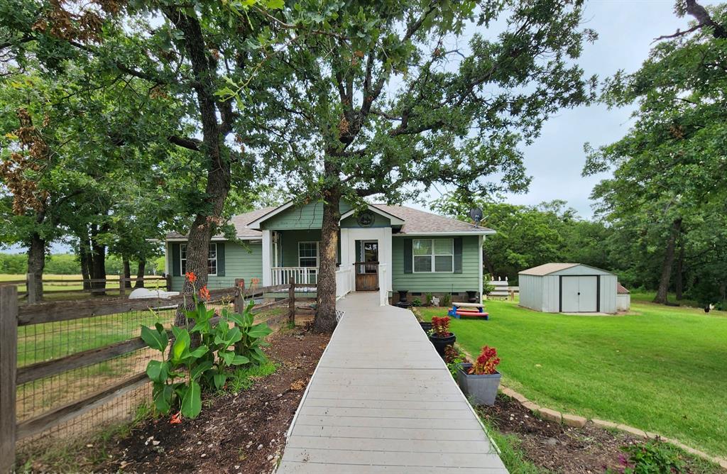 MOTIVATED SELLER! BRING US YOUR OFFER! Ideal for buyers looking for acreage, a shop, and no HOA in Wise County

2 ACRES • SHOP WITH ELECTRIC • RV HOOKUP • NO RESTRICTIONS • FULLY FENCED

Escape to your own private slice of Texas on this beautiful 2-acre property tucked away on a quiet private road in Paradise, TX. With no restrictions and plenty of space, this property offers the freedom to live how you want—bring your animals, your toys, and your plans.

This charming 3 or 4 bedroom, 2-bath home features an open-concept layout with a large butcher block island, perfect for gathering and entertaining. The flexible floor plan allows for a fourth bedroom, second living area, or home office to fit your needs.

Step outside to a large nice composite deck overlooking mature trees and peaceful surroundings, where you’ll enjoy quiet mornings, abundant wildlife, and evenings under the Texas stars around your own bonfire.

The property is fully equipped for country living with a 36x24 shop with electric, 240 welding hookup in shop and 3 bay doors, carport, RV hookup, 12x16 storage shed with loft, chicken pens, batting cage, big playground set, a separate well house. Fully fenced and ready for animals, hobbies, or simply enjoying wide-open space.

Conveniently located just minutes from town, shopping, dining, and schools—offering the perfect balance of privacy and accessibility.

Recently reduced and priced to sell—seller is ready to make a deal.

Ask about preferred lender incentives including free appraisal and no underwriting fee.