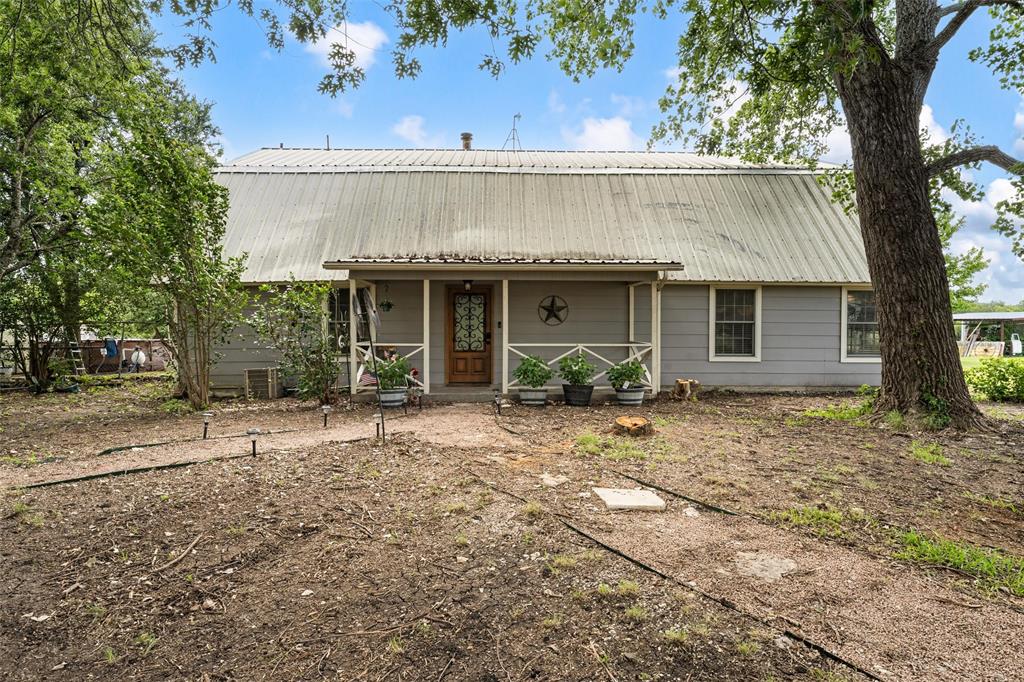 Opportunity, space, and potential come together at this Robinson ISD property situated on approximately 5.698 acres! Offering over 3,200 sqft of living space, this 6-bedroom, 3-bathroom home features a spacious downstairs layout with a large living area, eat-in kitchen, and plenty of room for gathering and entertaining. Upstairs, an additional secondary living space provides flexibility for a game room, media room, or separate family area. Bedrooms are situated with 3 up & 3 down, offering opportunity for dual primary suites on each level. Outdoors, the property continues to impress with a large covered back patio, a 20x20 metal shop with roll-up door, additional structure, above ground pool, cross fencing for animals and wooded space.  While the secondary cinderblock building is in tear-down condition, it has its own electric meter in place, presenting potential for a future second home, guest house, or ADU opportunity. This property does need updating and repairs, making it an excellent opportunity for buyers looking for a fixer-upper with acreage, space, and endless possibilities in Robinson ISD. Whether you’re looking to renovate, invest, or create your dream country property, this one is full of potential!