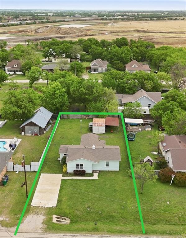 Welcome home to 204 E Bailey St which sits on .24 acres! This charming home is located in the heart of Ponder just down the street from Old Town. It has 3 bedrooms and 2 bathrooms with original hardwood flooring throughout. The kitchen has tons of natural light and quartz countertops. Laundry has its own dedicated room. The large grassy backyard would be a dream play space for kids and entertaining.  There is a storage shed with an attached carport. Don't miss out of this rare gem!