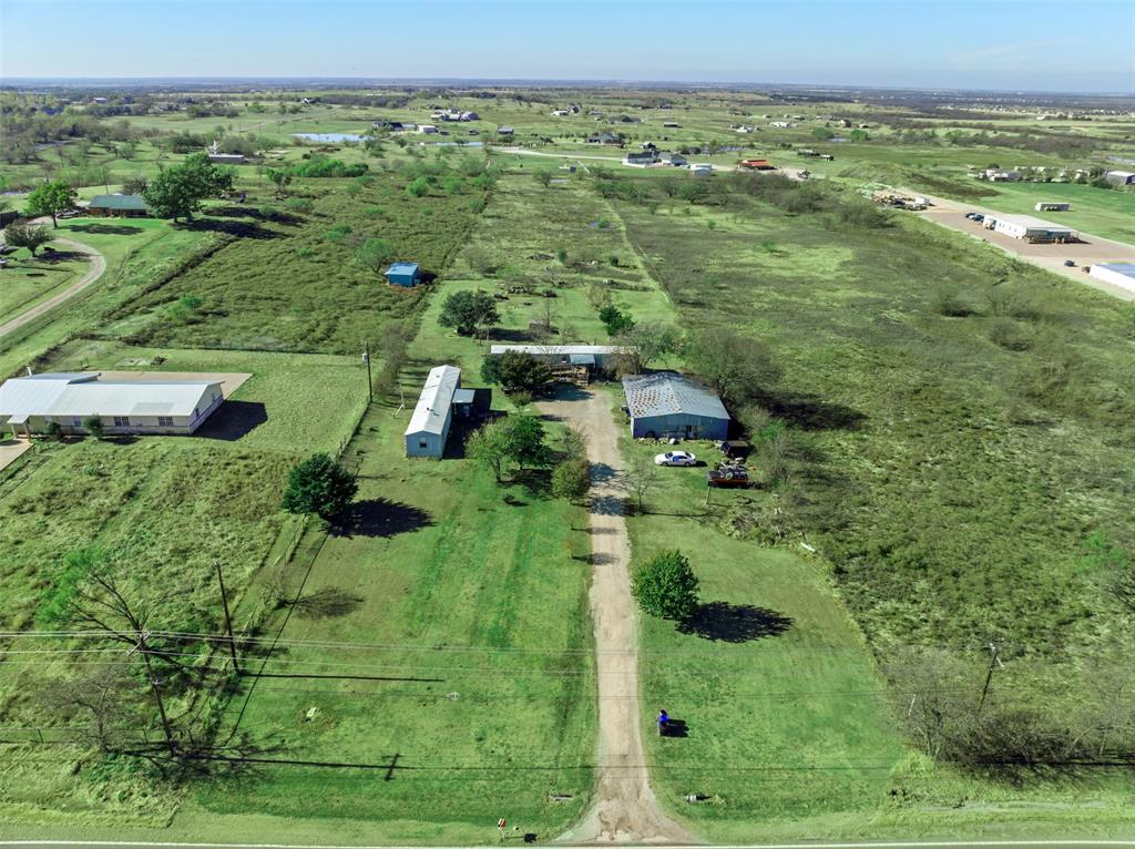 Discover 4.96 acres of opportunity in one of the fastest-expanding cities in the U.S., a community that blends small-town charm with modern convenience. Located just outside city limits in the ETJ, this property sits only minutes north of Celina’s historic and vibrant Downtown Square.

This unzoned property offers exceptional flexibility and future potential. Three adjacent land parcels immediately to the south are currently available, creating a rare opportunity to acquire 2410 N. Louisiana Dr. for future residential or commercial development, or as a strategic long-term investment. Positioned directly across from a planned 130-acre residential development and conveniently located near major thoroughfares, this property is ideally situated to benefit from continued area growth.

The property includes two mobile homes - one built in 1993 and the other in 1994, a metal barn, and a storm shelter, all sold AS IS.

Don't miss this rare chance to secure a versatile tract with truly unlimited potential.