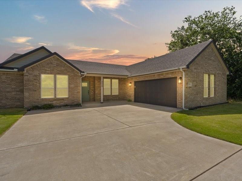 Welcome to this beautifully updated 3-bedroom, 2-bath single-story home offering 1,783 square feet of comfortable living in the sought-after, guard-gated Canyon Creek community. Whether you're a first-time homebuyer, downsizing, searching for a lake-area retreat, or looking for a peaceful place to work from home, this home checks all the boxes.

Enjoy added peace of mind with a new roof, gutters, and garage door, all replaced October 2025. Inside, the bright, open-concept floor plan seamlessly connects the living, dining, and kitchen areas, creating an inviting space.

The kitchen is designed to impress with white and light-gray granite countertops, stainless steel appliances, a large center island, abundant cabinetry, and a spacious pantry. Durable wood-like ceramic tile flooring flows through the main living areas, offering both style and easy maintenance.

The primary suite features a generously sized walk-in closet with custom shelving, while the attached two-car garage provides direct access to the laundry room complete with a utility sink for added convenience. 

Step outside to an east-facing backyard where the covered patio enjoys cool afternoon and evening shade—perfect for relaxing or entertaining. A wood privacy fence and full sprinkler system complete the outdoor space.

Living in Canyon Creek means enjoying an exceptional lifestyle with resort-style amenities, including two community pools, private Lake Granbury access, two boat docks, fishing pier, tennis and pickleball courts, a playground, and a rentable clubhouse. The community also offers 24-7 gated entry with daily courtesy patrol for added security and peace of mind. Located just minutes from the Historic Granbury Square, you'll enjoy easy access to charming boutiques, local dining, live entertainment, and the scenic beauty of nearby Comanche Peak. Combining modern updates, outstanding amenities, and an unbeatable location, this home offers exceptional value and a lifestyle you'll love.