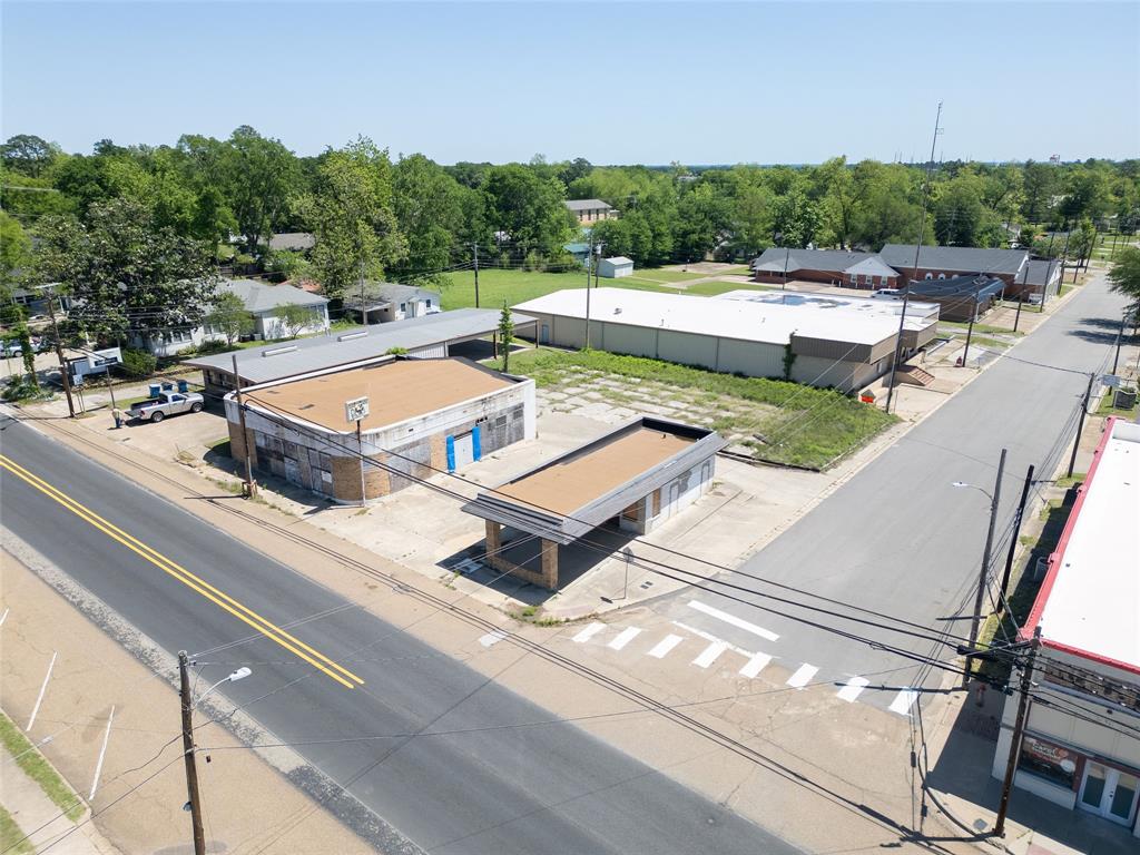 Prime commercial opportunity on Main Street in Winnsboro, Tx. 3,000 sq ft main building and an additional 600 sq ft space on the last available block in the immediate area. With a parking area already in place on this 0.333 corner lot and both buildings currently vacant and a blank slate, you can truly make it your own. Whether you’re thinking retail, office space, a small restaurant, or something completely different, this property has the space and potential to bring your ideas to life.