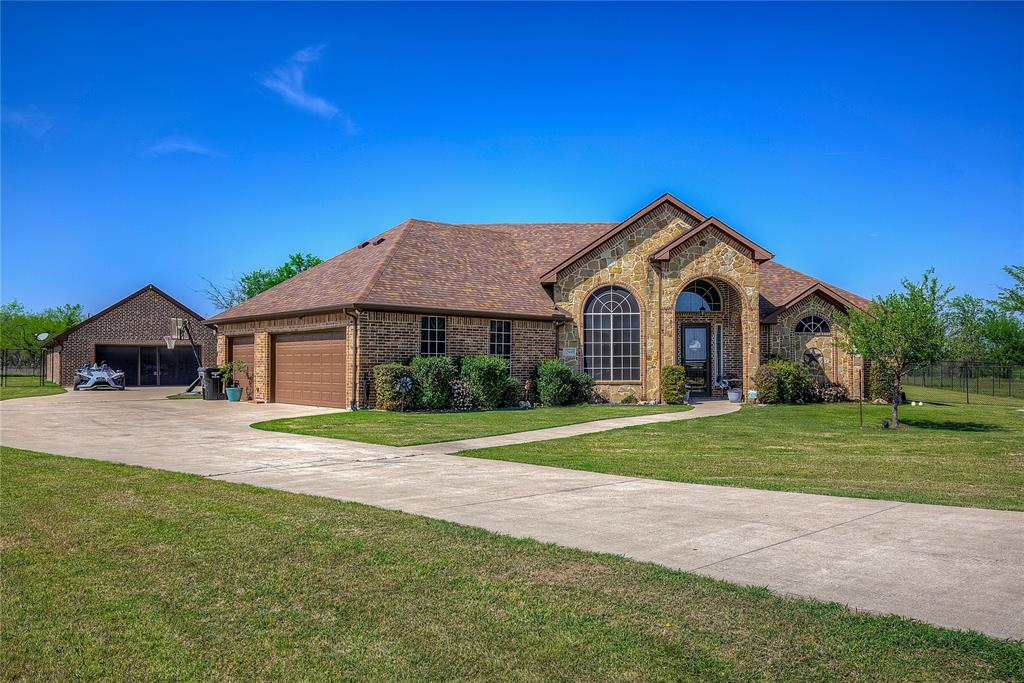 Escape to the serenity of peaceful country living in this beautifully maintained, one-owner estate overlooking a tranquil greenbelt. The main home features 3 spacious bedrooms, 2.5 baths, a 2.5 car garage, and a flexible game room or second living area—ideal for family fun or entertaining guests. You’ll love the open-concept design, the privacy of the split-bedroom layout, and the thoughtful upgrades throughout, including gleaming granite countertops, stainless-steel appliances, engineered hardwood floors, and soaring ceilings that fill the living area with light. Step outside to an expansive covered patio perfectly suited for evening gatherings or quiet mornings with nature. Both Main Home and Guest Home has new roofs since June 2025. Main home also offers a full home water softening system. Awesome Multi-Generational Home.

The fully fenced yard, mature landscaping, and wide-open views create a truly inviting retreat. Adding even more versatility, the property includes a charming 2021-built guest home with 2 bedrooms, 1 bath, a screened-in patio, and its own 2-car garage—ideal for extended family, guests, or potential rental income. A rare opportunity to own a beautifully kept main residence paired with a newer guest home, all in a peaceful country setting just minutes from town. PLEASE NOTE: THE GUEST HOUSE LIVING QUARTERS IS NOT REFLECTIVE ON THE TAX ROLLS!