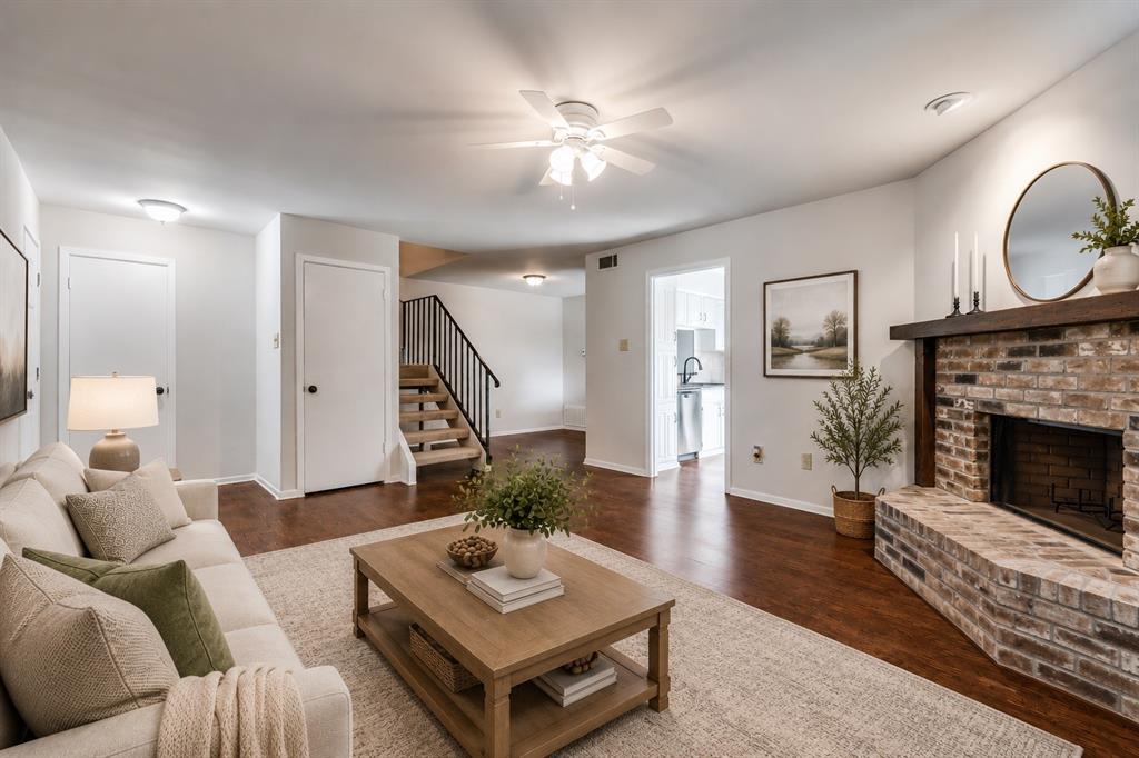 Welcome to this charming 2-bedroom, 2.5-bath condo in the heart of Richardson, offering comfort, convenience, and a prime location. With quick access to US-75 and the President George Bush Turnpike, commuting and exploring the area is effortless. Step inside to a warm, inviting living room with a brick, wood-burning fireplace and direct access to a private, fenced patio. The kitchen features abundant built-in cabinetry, and the refrigerator, washer, and dryer are all included, making this home move-in ready. The main level showcases wood-look laminate flooring throughout and a half bathroom for guests. Both spacious bedrooms are upstairs and include walk-in closets and private ensuite bathrooms. One covered parking spot is included. The HOA covers water, trash, and full use of community amenities, including a pool, adding convenience and value. Don’t miss the chance to own this well-maintained condo in a sought-after Richardson location! *Note: The HOA does not allow For Sale or Open House signs - please see the community map included in the pictures.*