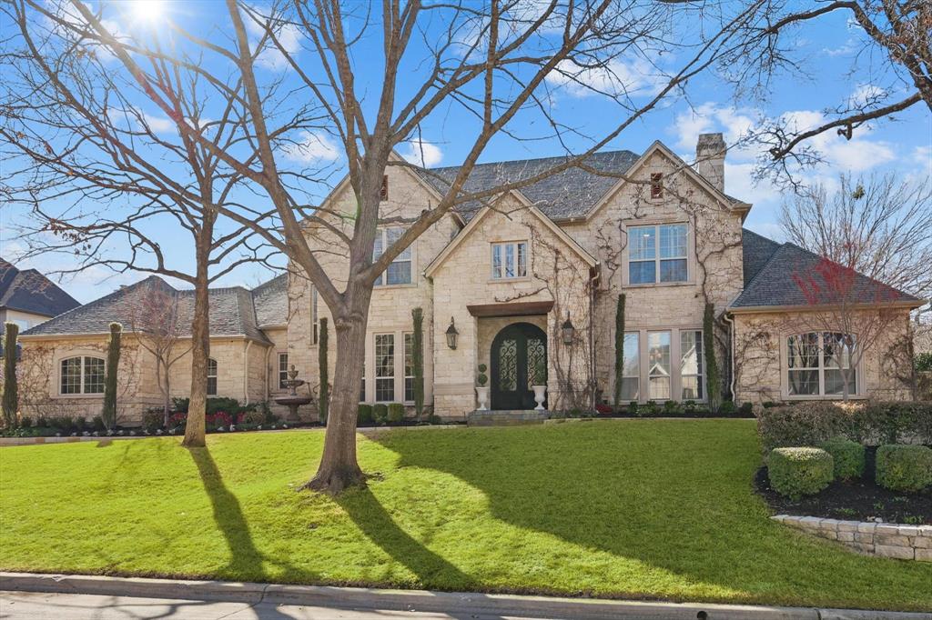 Luxury living at its finest! This exquisitely remodeled home with breathtaking curb appeal is located within the prestigious guard-gated community of Monticello Estates. The exterior wows with modern limestone, sweeping vines, steel double doors and lush landscaping. The curb appeal invites you in to find sophisticated designer details throughout; hardwood floors, dramatic staircase, modern fireplaces, statement lighting and open concept living spaces. The showpiece kitchen, boasting double islands with leathered quartzite, 48in Thermador range, custom cabinetry, spacious pantry and dry bar with undercounter drawer coolers, seamlessly opens to the family room and outdoor living. Primary suite is a retreat with a spa-inspired bath featuring marble flooring and tile, statement chandelier, and luxurious walk-in closet with custom built-ins and back entry to executive office.  Guest suite is located opposite on the first floor and also includes an ensuite. Take one of two staircases upstairs to find three additional bedrooms with ensuites featuring quartz countertops, shaker cabinetry and spacious walk-in closets. A versatile game or movie room featuring a wet bar with leathered quartzite countertops, beverage fridge and dishwasher, perfectly positioned to overlook the serene backyard oasis, and an airy, well-lit gym with skylight and durable rubber flooring concludes upstairs. Outside you will find a luxurious outdoor retreat perfect for all-season entertaining which includes a sparkling pool with cascading waterfall, relaxing spa, large covered outdoor kitchen equipped with built in cooking station, heaters, fridge, wood-burning fireplace and ample space to play. The driveway leads to two separate garages with epoxy flooring while newly installed AC unit ensure peace of mind. Don't miss this opportunity to live in one of Southlake's most desirable neighborhoods surrounded by mature trees, miles of walking trails, and tennis and pickleball courts all within the gates!