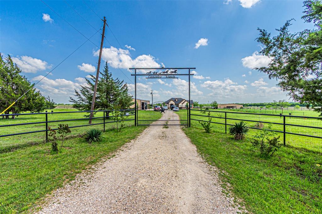 ENJOY COUNTRY LIVING ! BEAUTIFUL 2021 CUSTOM HOME SITTED ON 10+ ACRES OF LAND ! ............ THIS AMAZING BRICK AND STONE HOME HAS ITS PRIVATE WELL, HUGE TWO CAR GARAGE-WORKSHOP, LARGE BARN, PORCH,  NICE IRON PIPE FENCE ON FRONT, GRANITE COUNTER TOPS IN KITCHEN AND BATHROOMS, CUSTOM MADE CABINETS, MASTER BATH HAS SEPARATE VANITIES. THIS IS THE PLACE TO CALL HOME ............ MUST SEE IT !