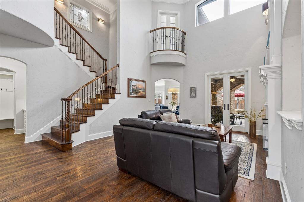 Located in the Wildwood community of Keller Texas 76262 in Tarrant County & zoned to Keller ISD, this 5 bedroom, 5 full bathroom custom home offers approximately 5,089 square feet of two story living on a 0.48 acre lot near Southlake, Westlake & North Fort Worth. The location provides convenient access to Hwy 114, Hwy 170, Hwy 377 & I35W, while remaining close to shopping, dining, parks & DFW Airport. Buyers exploring homes in Wildwood in Keller Texas 76262 may appreciate the combination of privacy, established surroundings & highly regarded Keller ISD schools. If you are searching for luxury homes in Keller Texas within Keller ISD, the layout offers expansive living areas, a dedicated office, media room, game room & multiple ensuite bedrooms designed for both entertaining & everyday functionality. The main living spaces feature soaring ceilings, oak hardwood flooring, plantation shutters & multiple gas fireplaces, creating warmth & architectural character throughout. The kitchen is designed for hosting with a professional style gas range, double ovens, copper sink, built-in ice maker, pot filler, large island & walk-in pantry. The primary suite provides a private retreat with dual vanities, jetted tub, frameless shower & spacious walk-in closets. Upstairs living spaces include a media room with screen & speakers, game room with wet bar & Juliet balcony, while secondary bedrooms offer comfort & flexibility. Outdoor living creates a resort-style setting with a heated saltwater pool & spa, automatic cover, water features, outdoor kitchen, fireplace, covered patio & Italian-style pergola. Additional features include landscape lighting, smart irrigation, oversized 3 car garage with epoxy flooring & gated driveway access. The home is served by Florence Elementary, Keller Middle School & Keller High School within Keller ISD. This property offers a strong combination of luxury finishes, resort-style outdoor living & positioning within the Keller Texas 76262 luxury market.