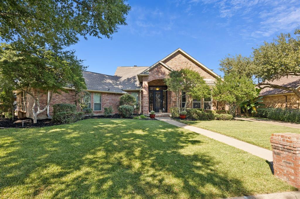 This stunning four bedroom home is situated on a beautiful corner lot in the desirable Woodridge Subdivision of Arlington! This residence blends elegance, comfort, and convenience, offering a thoughtfully designed floorplan with functional living spaces and modern updates. Inside, you’ll be greeted by gorgeous travertine flooring, decorative lighting and two spacious living areas with natural light. The open concept kitchen is a chef’s delight, featuring granite countertops, an electric cooktop, built-in oven, microwave and abundant cabinetry. A large breakfast area overlooks the backyard, making this space ideal for family gatherings or entertaining. The main level primary suite is a true retreat with hardwood floors, a peaceful sitting area, direct backyard access, and a luxurious en-suite bath complete with dual vanities, a garden tub, and separate shower. A convenient guest bedroom is also located downstairs, while two additional bedrooms upstairs provide flexibility for family, a home office, or guests. Step outside to your own private oasis featuring a sparkling pool, lush landscaping, and plenty of patio space - perfect for barbecues, pool parties, or relaxing in total privacy. The pool has a variable-speed pump less than a year old and the light was recently replaced with an LED bulb offering full color control. The sprinkler system is managed by a Wi-Fi controller for added ease. Several windows were replaced within the past year, ensuring energy efficiency and curb appeal, and the main water line from the city to the house was replaced approximately three years ago. The three-car garage and corner lot provide ample storage and impressive curb presence. Living in Woodridge means enjoying a vibrant neighborhood in the heart of Arlington, just minutes from shopping, dining, and entertainment, plus AT&T Stadium, Globe Life Field, and Six Flags Over Texas, nearby parks, golf courses and Joe Pool Lake.