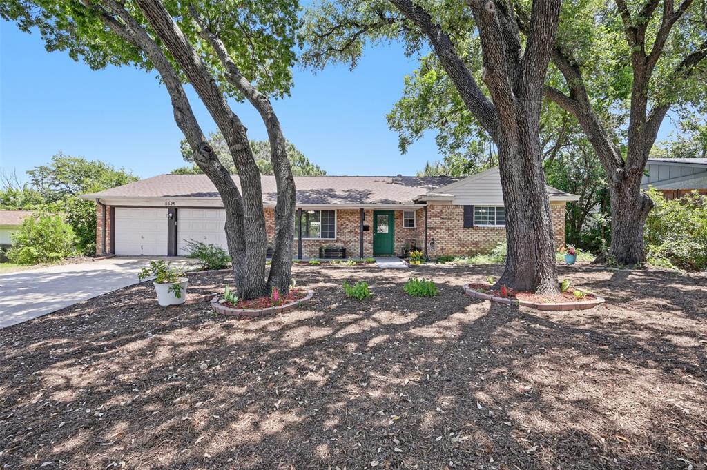 Nestled in the highly sought-after Historic Wedgwood Square neighborhood of South Fort Worth, this beautifully updated brick home offers the perfect blend of timeless charm and modern comfort. Filled with natural light, the spacious floor plan features three bedrooms, two bathrooms, an oversized living room, and a generous family room anchored by a striking wood-burning fireplace—creating warm, inviting spaces for gathering with family and friends.
The thoughtfully updated kitchen and living areas flow seamlessly for everyday living and effortless entertaining. Outside, you’ll find a private backyard retreat with mature shade trees, a covered patio, fire pit, raised garden beds, a large storage shed, and plenty of room to relax or play.
A welcoming front porch adds classic curb appeal, while the attached two-car garage offers ample storage and convenience. Well maintained and move-in ready, this home is a rare opportunity to enjoy the character of an established neighborhood with the updates you’re looking for.
