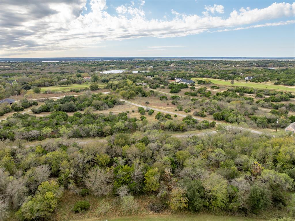 Come take a look at this gorgeous lot located across from the New Course! Enjoy a relaxed lake life of fishing, picnicking, and kayaking just steps away from your property. Only an hour’s drive from both Dallas and Waco, making it a perfect location to build the home of your dreams or weekend getaway spot . Two award winning 18-hole golf courses with 36 rounds of golf included per year. Restaurants, tennis and basketball courts, 4 pools, boat ramp, marina, fitness center, Spa, Hotel, cabins, 24 hour security and the breathtaking beauty of Lake Whitney!