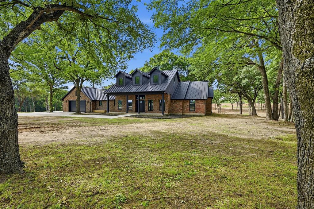 Set on 22 gently rolling acres in Sadler, TX, this beautifully remodeled 5-bedroom home offers the perfect blend of comfort, versatility, and wide-open space. Thoughtfully updated, the residence features a flexible floor plan with one bedroom ideal for a private home office. Upstairs, a massive loft creates an inviting second living area, complemented by a bonus room with its own bath—perfect for guests, hobbies, or a media space. The land has been carefully cleared of underbrush, revealing a scenic, park-like setting with mature trees, natural contours, and sweeping views, like living in a tree house! A large open pasture adds even more functionality, making the property well-suited for animals, recreation, or future improvements. Whether you’re envisioning a private estate, a peaceful weekend retreat, a hobby farm, or a charming ranchette, this property delivers the space and flexibility to bring your vision to life. For added versatility, the acreage can also be divided, offering an option to purchase the home with approximately 11 acres. A peaceful, rural setting with the convenience of North Texas amenities nearby including Hagerman Wildlife Reguge, Lake Texoma, MegaStar Casino and Rock Creek Golf Club. Schedule your private tour today!