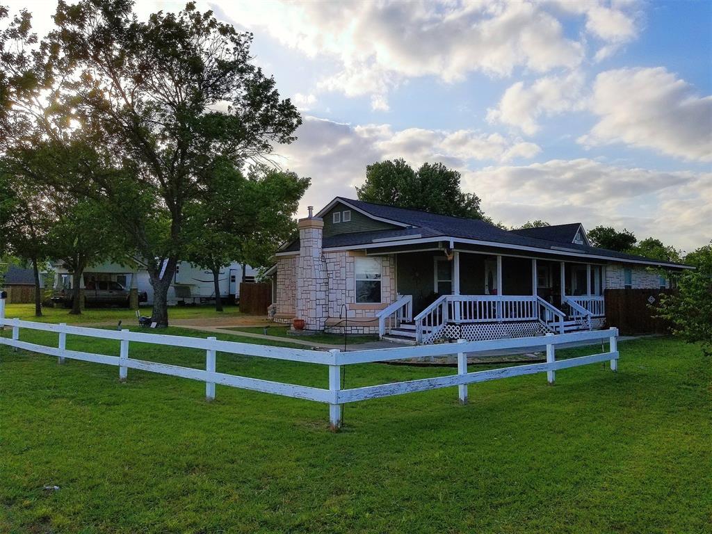 Lovely 3 bedroom home with a Texas sized covered porch for those family get togethers and a cozy screened in back porch. Perfect for entertaining. This home features a beautifully landscaped backyard on a large lot with a gazebo, a man or babe cave and outdoor barbeque area. Extra parking for Rv, boat or extra vehicles, a double gate and a large floored in storage room upstairs. Tastefully decorated kitchen with granite countertops, gas stove and plenty of counter space and cabinets. Wood burning stove and large walk in showers are some of the extra features of this wonderful home just waiting for a new family.