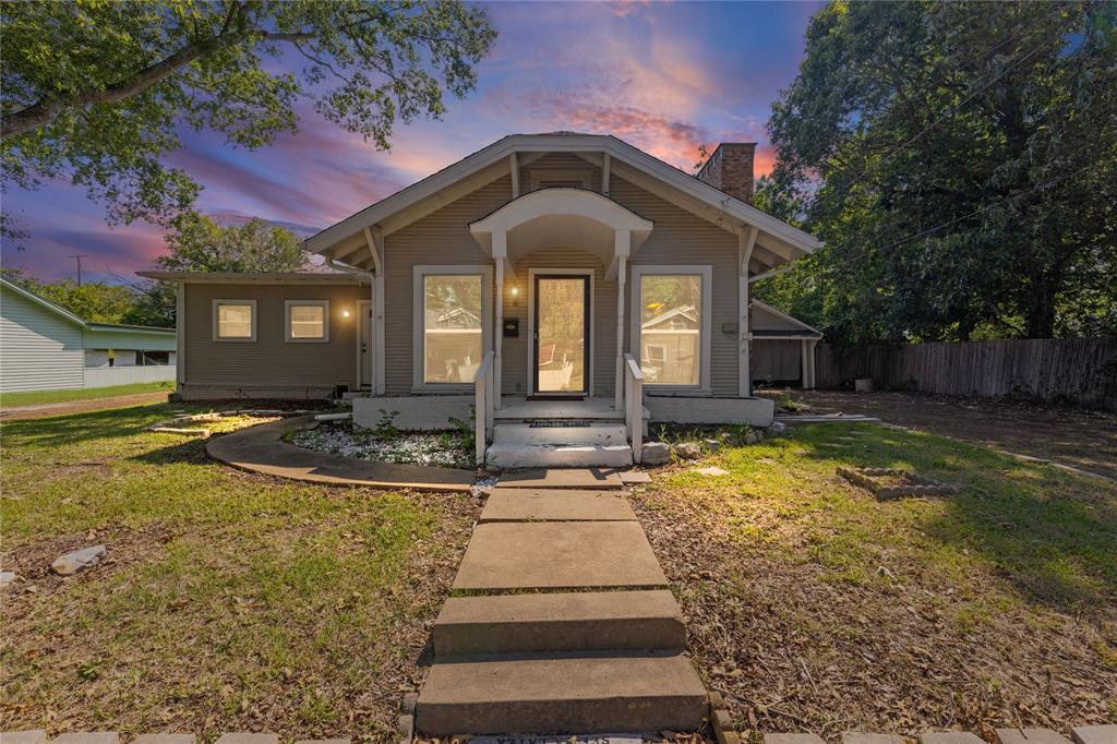 Beautiful property in the heart of downtown Commerce! Step inside this charming blank canvas, full of character, and potential! Whether you’re looking for a great investment opportunity or a place to make your own, this home has great bones and is ready for your personal touches! The Kitchen boasts tons of cabinet space, electric range, dishwasher, built in microwave, and a cozy breakfast area that’s perfect for busy mornings with the kids. Enter into the warm and inviting living room! It centers around a lovely wood-burning brick fireplace with raised hearth that adds to its charm! You will love the original hardwood floors that remain in several rooms! The primary suite includes a huge walk-in closet, an en-suite bathroom that also connects to another room, and an outside entry! The layout is truly unique which is typical to this era of home! There are multiple possibilities for the primary suite if you prefer the large room as a huge family room or game room! The primary bath is a showstopper, completely updated with a dual sink vanity and large walk-in shower! The secondary bathroom is also updated with tile shower and sliding glass door entry! At the rear of the home you will find the perfect space for a home office or mud room conjoined with the laundry area giving you extra functionality and convenience! Outside, enjoy a large backyard complete with dog run, a two-car carport, and two extra rooms that can be transformed into whatever you need, storage, workshop, or a hobby to fix up for your very own man cave! So many possibilities all the way around, there is even potential to convert to multi-family and with some renovation turn into a duplex based on zoning. Don’t miss this one, it won’t last long!
