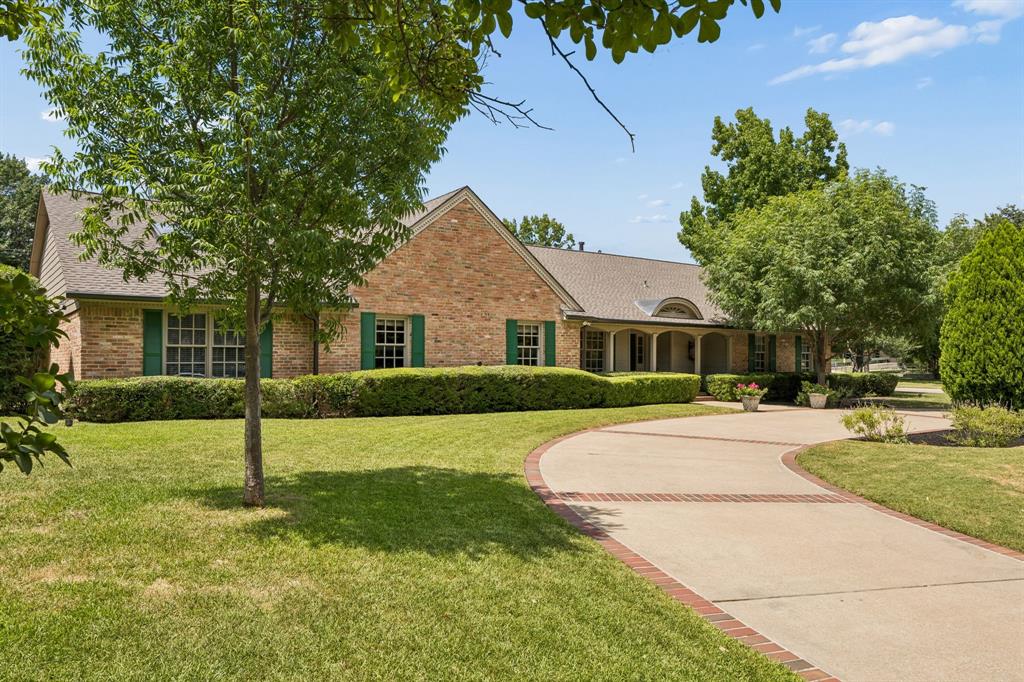Welcome to this charming Northwood Hills single story home, where timeless appeal meets exceptional space and thoughtful updates. This expansive family home offers five bedrooms, each with its own private bath, and five versatile living areas, including a formal living room, library, family room, sunroom, and a bonus room ideal for a home gym, music studio, hobby room, or playroom. Designed for both everyday living and entertaining, the open floor plan features soaring coffered ceilings and quality craftsmanship throughout. The stunning kitchen was completely remodeled and expanded in 2019–2020, opening seamlessly to the family room. At its heart is an impressive 16-foot quartz island, complemented by premium appliances that will delight any home chef. The spacious primary suite is a true retreat, featuring a cozy sitting area with a fireplace, dual bathrooms, and separate walk-in closets. Enjoy the suite as it is or customize it to create your dream private sanctuary. A split fifth bedroom serves as an ideal in-law or guest suite, complete with its own fireplace, French doors leading to a private side patio, and a wheelchair-accessible shower. Step outside to your own private backyard oasis, surrounded by mature shade trees and lush landscaping. Extensive outdoor improvements completed in 2019 include a beautifully renovated 37-foot diving pool, pool heater, fire pit, and a fully equipped outdoor kitchen with a gas grill and Kamado Joe ceramic grill. An electronic sliding gate provides secure access to additional enclosed parking. Additional peace of mind comes with a new roof installed in April 2026. With its generous living spaces, extensive updates, resort-style backyard, and sought-after Northwood Hills location, this exceptional home offers outstanding value and an incredible opportunity.