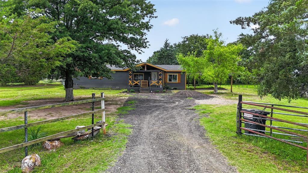 Beautifully remodeled manufactured home on 2.5 acres in Quinlan, TX! This home is probably one of the nicest manufactured homes you will see. It features a clean, modern feel, a comfortable layout, and a beautiful master bathroom with a freestanding tub. Sitting on approximately 2.5 acres, there is plenty of room to enjoy country-style living, bring your farm animals, garden, park equipment, or simply enjoy the extra privacy and space. Conveniently located near Lake Tawakoni, this is a great opportunity for a buyer looking for land, comfort, and affordability all in one property.