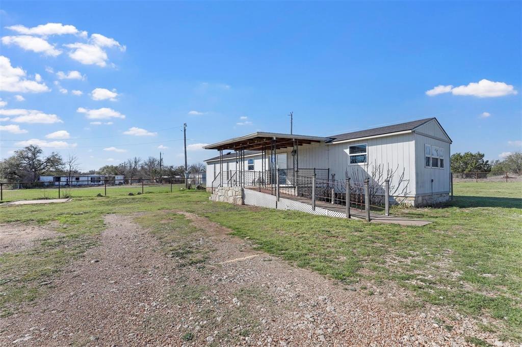Welcome to the space, freedom, and Lake Granbury lifestyle buyers are craving! Sitting on nearly half an acre across two lots, this two-bed, two-bath home delivers room to breathe, room to store, and room to live — all in a well-established Granbury community with incredible amenities! Inside, you’ll love the flexible layout featuring two generously sized primary bedrooms, each with its own full bath — ideal for roommates, guests, or multi-generational living. One suite offers handicap-accessible features, adding comfort and versatility rarely found at this price point. Natural light fills the living spaces, creating a bright, open feel that instantly feels like home. Step outside and the value really shows! The oversized yard gives you endless possibilities — garden, workshop projects, outdoor entertaining, or simply enjoying quiet Texas evenings. Multiple storage buildings provide plenty of space for tools, hobbies, and lake toys, while the gated entry adds charm and function. And then there’s the lifestyle: As a resident of Oak Hills, you gain access to community pools, playgrounds, sports areas, a fishing pier, and a boat ramp — putting lake life within minutes of your front door. Whether it’s weekend boating, fishing at sunset, or a fun time at the park, this neighborhood makes it easy to enjoy it all. Homes with this much land, this much functionality, and this many amenities don’t come around often — and they don’t sit long. If you’re looking for affordable space near Lake Granbury, this is one you need to see now, not later!
Flip Ready, Light Rehab or Heavy Rehab, Contractor Special, Priced for Immediate Sale, Make This One Shine, Endless Potential, Bring Your Vision, Bring Your Crew, Perfect Starter Flip, Investor Target Area.