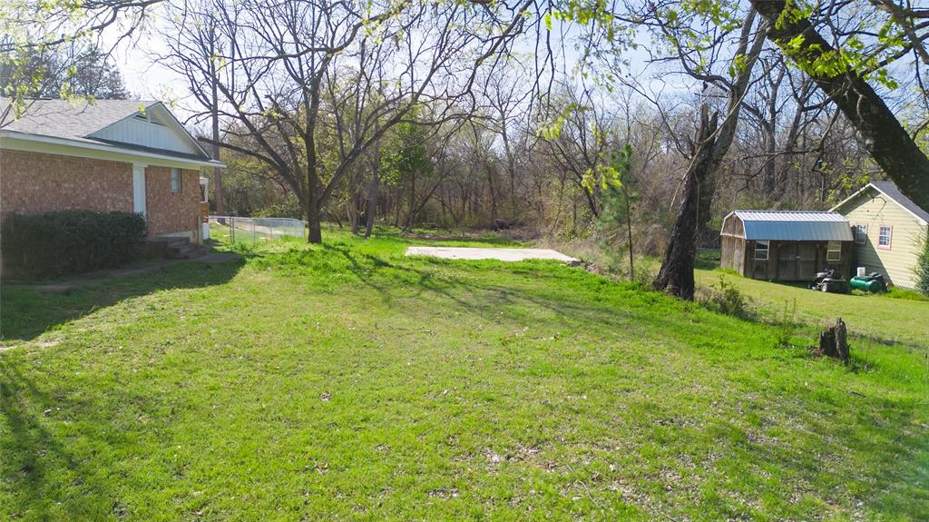 Discover the potential of this almost QUARTER ACRE lot, nestled in the Sunny Side subdivision in the rapidly growing & very charming community of Denison, Tx! Whether you're a builder looking for your next development or a homeowner ready to create your own private retreat, this unique lot offers flexibility, natural surroundings & a blank canvas to build the perfect custom home. Perfectly situated on a little less than .25 of an acre, this lot offers ample outdoor space to allow customization to suit your specific needs. And with public utilities available nearby, this is an excellent site for new construction! This lot has endless potential in one of North Texas most exciting & fast growing areas. The blend of small town charm & modern convenience is perfect for future homeowners seeking city proximity with country privacy. Enjoy a quick commute to Sherman, Lake Texoma, Waterloo Lake Regional Park, Downtown Denison, Hwy 75, schools, shopping & dining. This location is perfect for commuters or those seeking comfort & convenience! No HOA!