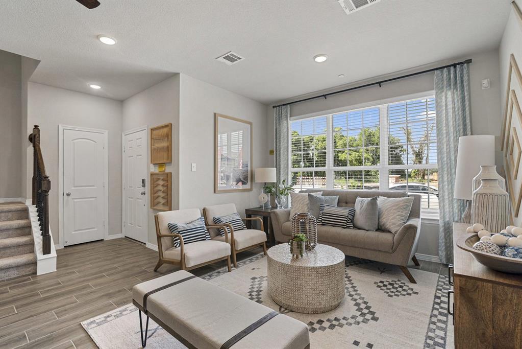 MLS# 21287988 - Built by HistoryMaker Homes - Ready Now! ~ Two-story townhouse in Heartland Townhomes offering 1,467 sq ft with 3 bedrooms and 3 baths (2 full, 1 half). Construction stage: Complete; estimated completion 5-31-2026. Open floorplan includes living and dining areas, pantry, and covered patio adjacent to a greenbelt. Interior features: walk-in closets, double vanity, cable and high-speed internet available. Flooring: luxury vinyl plank and carpet. Two-car garage, slab foundation, composition roof. Heating: central electric; cooling: central air with ceiling fans. Crandall ISD — Opal Smith Elementary, Crandall Middle & High School.