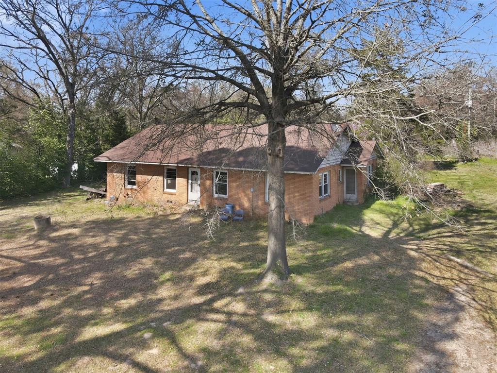 A unique in-town opportunity: a historic ranch home situated on over 4 acres with full city zoning. Whether you’re looking to renovate, expand, or pursue a development project, this property provides the scale and location to support multiple strategies. Strong upside potential for builders, investors, or visionaries.  This property is in mid renovation; rooms are not designated. 
Windows have been replaced.