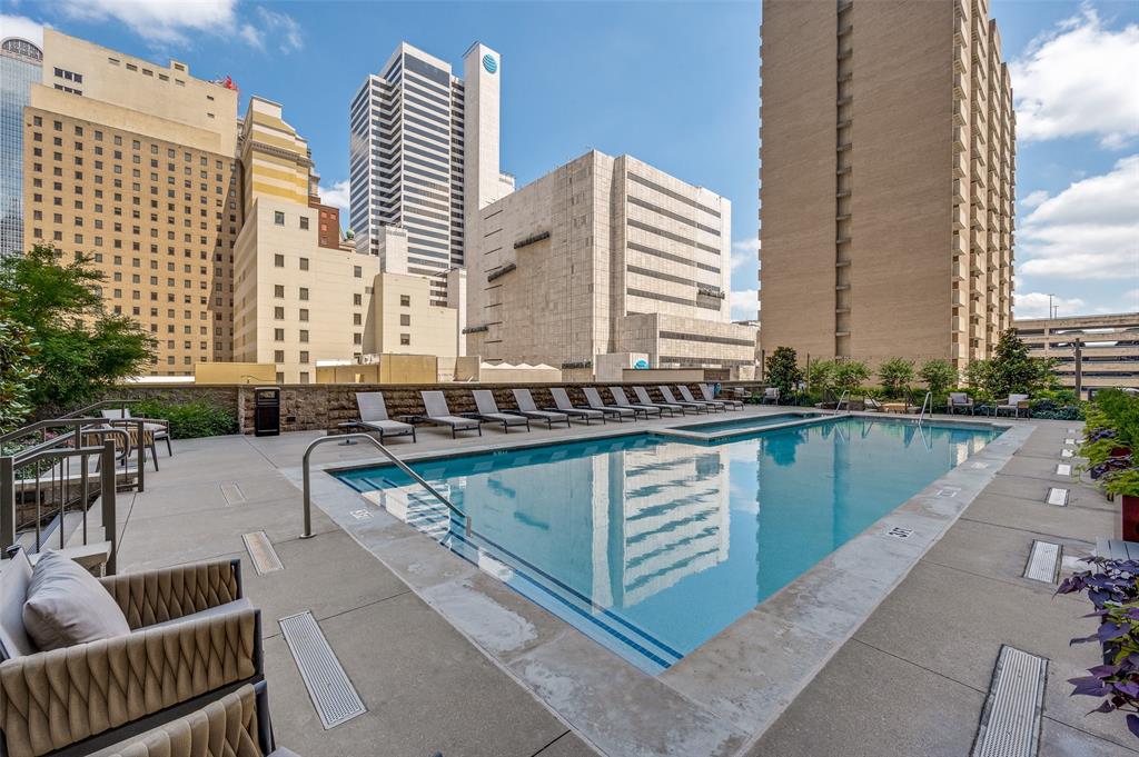 Unit 701 at The Metropolitan puts you on the 7th floor of one of Downtown Dallas's most livable addresses. The corner position faces west. You get true sunset views and city lights from a private balcony every evening.

The unit runs just over 1,550 square feet with three bedrooms and two and a half baths. Each bedroom has its own bathroom and a custom walk-in closet, so it works as well for guests as it does for daily life. Marble-look LVP flows throughout. The kitchen opens to the living space and features a gas range, Frigidaire stainless appliances, granite counters, and a metallic backsplash. A full utility room and recessed lighting round out the practical side of the floor plan.

One assigned garage space is included. A second is available to lease.

The Metropolitan delivers full-service amenities: 24-hour concierge, on-site security, professional management, a lap pool with hot tub, grilling areas, fitness center, media room, conference rooms, and private green space. Belo Garden sits right next door.

Downtown Dallas carries a Walk Score of 92. From this address, you can walk to Klyde Warren Park, the AT&T Discovery District, the Dallas Arts District, the Majestic Theatre, Neiman Marcus, and the Dallas Farmers Market. DART Rail is steps away, connecting you to the entire metro without a car. Restaurants, coffee, nightlife, and live music fill the blocks around you.

This one works as a full-time residence or a lock-and-leave urban base. Schedule a visit today!
