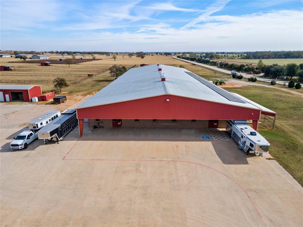 Nestled in the heart of Oak Point, Texas, Prestonwood Polo Club
Equestrian enthusiasts, breeders, and trainers: a fantastic opportunity highlighted by the property, which consists of a 12-stall barn, a 30000 sqft covered riding arena, wash racks, and big fans. Features include fencing and gated fencing. The entry barn is designed for both beautiful and functional matted stalls. Automatically watering systems, washing racks, grooming stalls, covered runs, and feed rooms. On-site, a complete and half bath, a charming apartment upstairs with an efficiency perfect for foreman or guest accommodations, and the featured property also consists of two bedrooms, two baths, an open-concept living room, and a covered porch. It has its own private water well and storage tank on site. A bonus storage shop can be used for hay and or equipment. 
The property has tenants until December; if bought, an investment tenant could stay on. 
All information provided is deemed reliable but not guaranteed and should be independently verified.