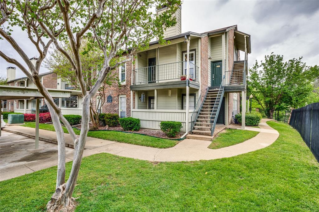 Spacious, updated & conveniently located! Just minutes from Addison, Preston Road, and the Dallas North Tollway, this 2-bedroom 2-bath condo is nestled in the quiet and established Woodhaven Condominiums community in North Dallas. Step inside and you’re immediately welcomed by soaring ceilings, natural light, and a stone fireplace that anchors the open living space. The airy layout creates a warm yet expansive feel. Just off the living area, a private patio balcony extends your space outdoors. The kitchen flows into the main living area and features marble countertops, a glass backsplash, and stainless steel appliances. This unique two-story floorplan offers flexibility with two primary suites, each with generous closet space. The upper-level suite provides a private entrance and separate access, making it ideal for guests, a roommate setup, or a private home office retreat. Both bathrooms have modern tile and granite countertops. Newly installed energy-efficient Pella double-pane Energy Star windows help reduce outside noise and improve insulation for year-round comfort, while ProVia exterior doors add durability, security, and weather resistance. New carpet on the stairs adds a fresh, updated touch. Additional conveniences include a reserved covered parking space just steps from the unit. Residents of Woodhaven Condominiums enjoy access to community amenities including a pool and tennis court. With premier dining, shopping, and entertainment nearby and easy access to major commuting routes, this is a rare opportunity to own a spacious, flexible condo in a highly desirable North Dallas location.
