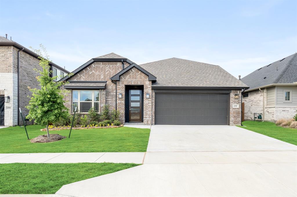 NEW! NEVER LIVED IN. Move-In Ready! Bloomfield Homes’ Redbud II plan offers 5 bedrooms, 3 baths, and a flexible two-story layout designed to feel unique and make daily life easier. The exterior pairs brick with a stained 8’ 5-Lite front door, gutters, and low-E windows for a clean, finished streetscape. Laminate wood flooring carries through the main living areas, creating continuity from the foyer into the family room where natural light pulls the space toward the covered patio beyond. The kitchen anchors the center of the home with a functional island, quartz countertops in Coquina with a double-eased edge, a pantry for storage, and modern flat panel cabinets with long pulls, with an entire wall flushed for a modern storage solution. 3 secondary bedrooms on the main level are thoughtfully arranged near a shared bath for everyday convenience. The primary suite is privately set and features a deluxe bath with a dual sink vanity, garden tub, separate shower, quartz countertops, and a generous walk-in closet. An upstairs game room provides another living space to flex, along with the final bedroom and bath. Practical details like a mud room, tankless water heater, tile flooring in baths and utility spaces, carpet in bedrooms, blinds, and a 2-car garage complete the interior with function in mind. Located in Hulen Trails, residents enjoy access to community amenities including trails, greenbelts, a playground, a soccer field, a community pool with bathhouse, dog stations, and a park, all woven into the neighborhood design. Visit the Bloomfield Homes model in Hulen Trails to learn more about the Redbud II and explore available opportunities in this community!