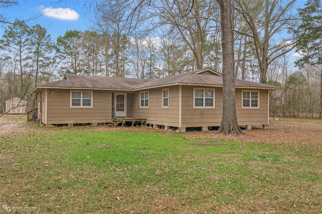 This spacious four-bedroom, two-bath home offers room to spread out with an open floor plan that seamlessly connects the living and dining areas. Gorgeous pecan wood floors add warmth and character throughout the main living spaces. The remote primary suite provides privacy and features an ensuite bath with a large walk-in closet. Situated on 2.13 peaceful acres, this property comes with no city taxes, a private well and septic system, and ample storage. Enjoy quiet country living with space to grow—all while qualifying for zero-down Rural Development financing.  See Private Remarks.