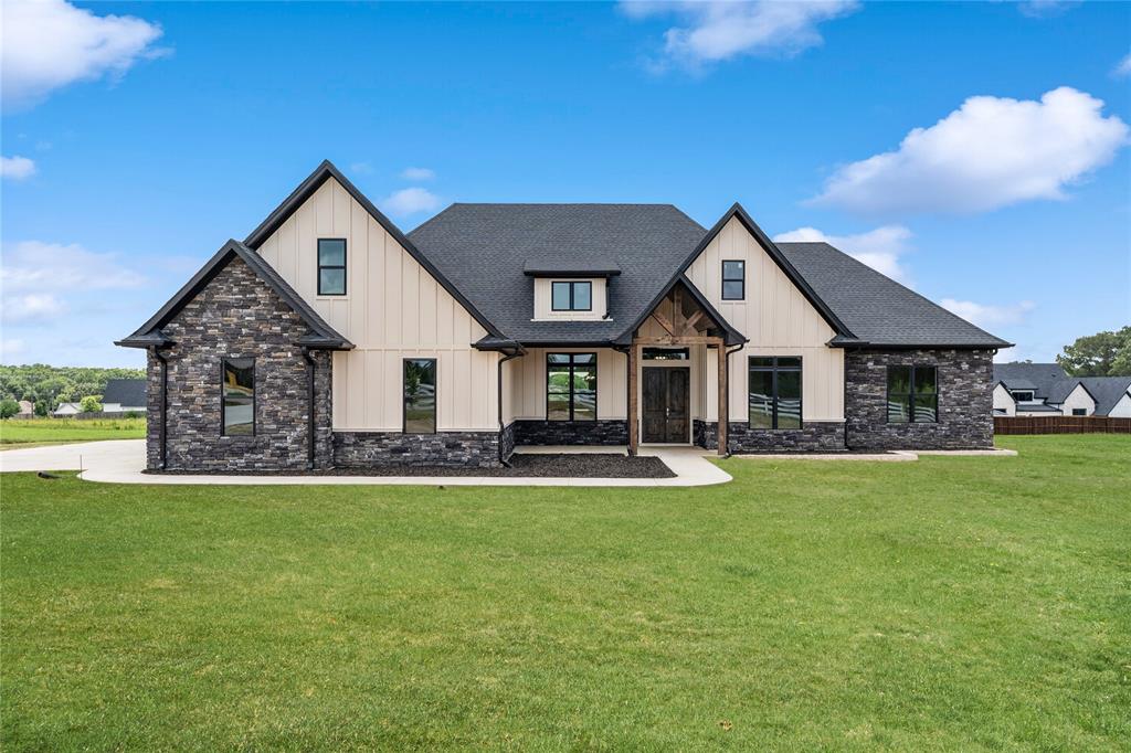 Welcome to this stunning 5-bedroom, 3.5-bath, 3-car garage home offering 3,309 square feet of beautifully crafted living space on 1.18 acres in the highly sought-after Blue Ridge Estates in Bullard—just minutes outside Tyler. Built brand new in 2025, this home showcases exceptional design, quality finishes, and thoughtful details throughout.

As you arrive, you’re greeted by a large front yard, an expansive driveway, and an inviting exterior that creates a memorable first impression. Inside, the open-concept layout immediately draws your attention, with the kitchen, living, and dining areas forming the heart of the home. The kitchen is both elegant and functional, featuring custom cabinetry, leathered countertops, unique light fixtures, abundant storage, a grand island, and a large window above the sink overlooking the backyard.

The living room impresses with soaring ceilings, a beautiful fireplace, and large windows that fill the space with natural light. Hardwood floors add warmth and character, complementing the home’s modern yet timeless style. All bedrooms are generously sized, while the bathrooms feature spacious layouts and stylish, contemporary finishes.

The primary suite feels like a private retreat, complete with detailed ceiling work, a luxurious soaking tub, a separate walk-in shower, and an oversized closet with built-in cabinetry and shelving for exceptional organization. Additional highlights include a large utility room and a functional mudroom for everyday convenience.

Upstairs, you’ll find a versatile bonus room with its own bathroom—perfect for a game room, media space, playroom, or guest suite. Step outside to enjoy the oversized covered back patio, ideal for entertaining or relaxing, along with a huge backyard offering endless possibilities for outdoor living.

With its modern craftsmanship, spacious design, and prime location, this beautiful new construction home offers the perfect blend of luxury, comfort, and space.