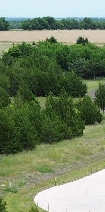 RARE OPPORTUNITY TO OWN 1.54 ACRES LOCATED IN EMERALD HEIGHTS COMMUNITY SURROUNDED BY GORGEOUS TREE LINED CUSTOM HOMES. THIS PROPERTY OFFERS A PRIVATE PEACEFUL SETTING WITH PLENTY OF ROOM TO BUILD YOUR DREAM HOME, SHOP, BARN, POOL OR OUTDOOR LIVING SPACE.  ENJOY THE QUIT COUNTRY FEEL WHILE STILL HAVING EASY ACCESS TO MAJOR HIGHWAYS FOR COMMUNITY, PLUS NEARBY LAKE RAY HUBBARND AND LAKE LAVON FOR BOATING, FISHING AND RECREATION. THIS IS A STUNNING HOMESITE IN A DESIRABLE CUSTOM HOME NEIGHBORHOOD WITH SPACE, PRIVACY AND BEAUTIFUL NATURAL SURROUNDINGS. (additional acreage is also for sale adjoining this property)