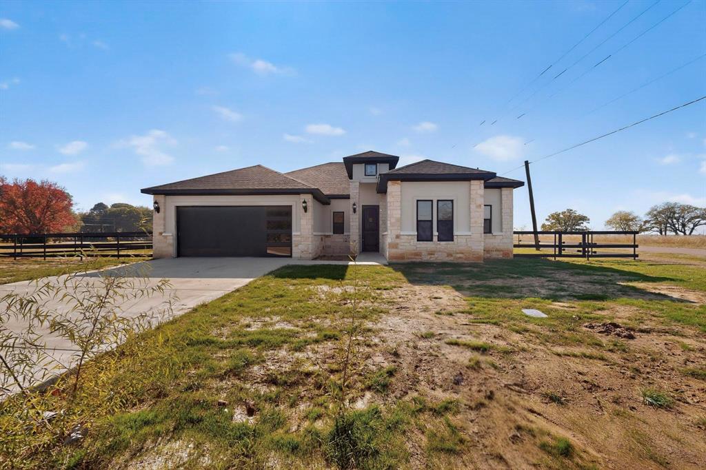 Welcome to this beautifully crafted home located on a premium corner lot in the highly desirable Key Ranch Estates community. This spacious 4 bedroom residence blends modern comfort with thoughtful design, offering ensuite bathrooms and walk in closets in every bedroom. Two secondary bedrooms feature a convenient Jack-and-Jill ensuite, while the luxurious primary suite boasts a dual sink vanity, garden tub, and separate stand up shower.

High ceilings flow throughout the home, creating an open and airy feel. The inviting living room centers around a cozy wood burning fireplace, perfect for relaxing evenings. The kitchen is equipped with all new stainless steel appliances, complemented by a walk in pantry, breakfast nook, and a separate formal dining area ideal for both everyday meals and special gatherings. Entertain with ease using the wet bar and dry bar designed for hosting.

Additional features include a dedicated laundry room with sink, a functional mudroom off both the front entry and 2-car garage, and a spacious covered rear porch ready for outdoor dining and entertainment. The generous lot provides ample potential for future enhancements such as gardens, a pool, or extended outdoor living.

This newly built home offers exceptional comfort, style, and room to grow—an outstanding opportunity in Key Ranch Estates.