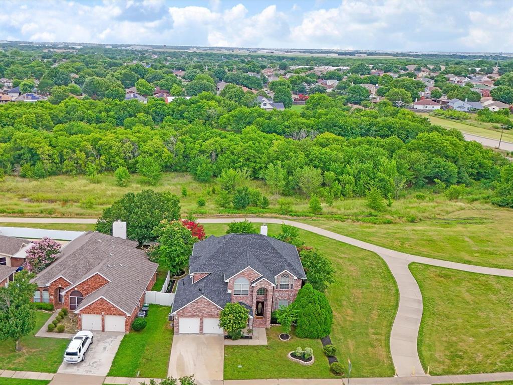 Before you tour another home, come experience one that truly stands apart. Backing directly to peaceful green space with walking and biking trails instead of rear neighbors, this beautifully updated home offers the perfect blend of privacy, convenience, and modern comfort. Plus, the seller is offering a $2,500 interest rate buy-down credit along with a home warranty credit of $500 to help make your move even easier. Major updates have already been completed, including a new roof, renovated bathrooms, fresh interior paint, updated flooring, modern lighting, and professional landscaping, allowing you to move in with confidence. Inside, the open concept floor plan is designed for both everyday living and entertaining. The updated kitchen features granite countertops, crisp white cabinetry, newer appliances, and a built in wine refrigerator, all overlooking the spacious living and dining areas. The oversized primary suite is a true retreat, complete with a large walk-in closet, soaking tub, separate shower, and a flexible adjoining bonus room that works beautifully as a home office, nursery, fitness space, or private sitting room. The secondary bedrooms are generously sized with ample closet space and ceiling fans throughout. Located in an established neighborhood, you'll enjoy direct access to the park and trails, easy walks to the neighborhood elementary school, and convenient access to shopping, dining, and major commuting routes. This is the kind of home that combines thoughtful updates, an exceptional location, and financial incentives that are becoming harder to find.