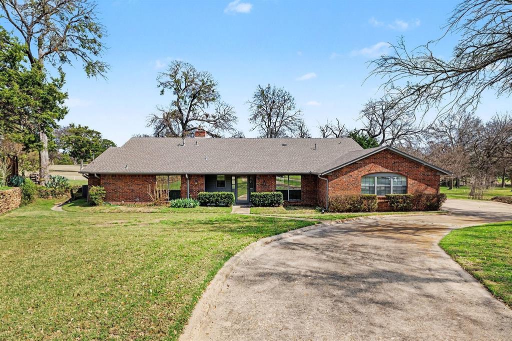 You will fall in love with this beautifully renovated single story home on a half acre golf course lot. Situated on the 11th hole of the Dallas Golf Club, this property offers incredible views of a uniquely serene environment that is rarely available. The house was renovated two years ago and has a wonderful open floorplan, modern eat-in kitchen with quartz countertops, large living room with vaulted ceilings, dining and den and lots of windows. Sit out on the massive covered back porch and listen to the crickets and birds  interacting. Look up at night to the endless sky of stars. This is the rare setting of your new home and enjoy your attached garage, circle driveway with extra parking, three spacious bedrooms with spa like primary bathroom, jack and jill, ceramic tile, hardwoods and luxury vinyl plank flooring, and much more. An incredible rare opportunity at a very good price!