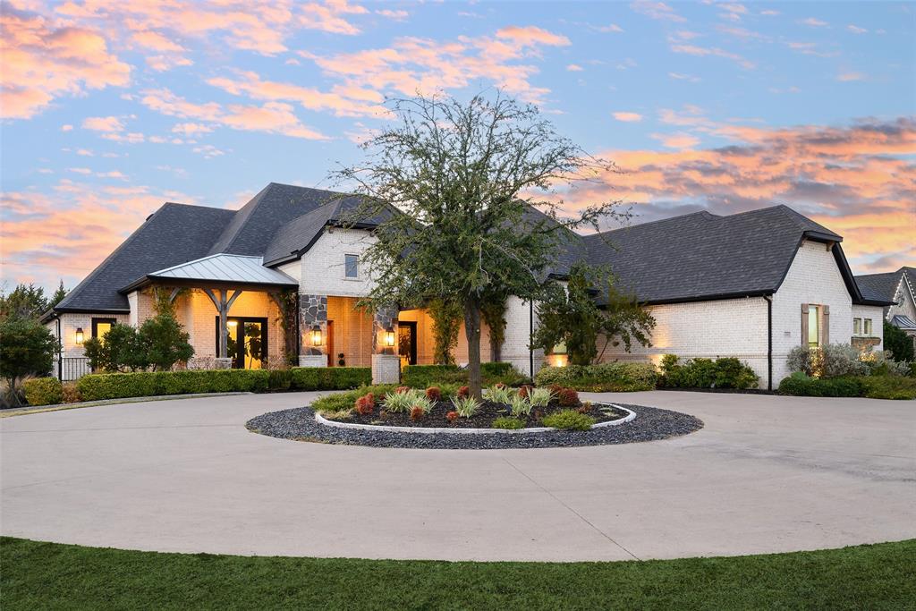 Exceptional custom Dave R Williams estate on a sprawling 0.75 acre lot in Prosper, offering 6 bedrooms, 5.1 baths, and 5,154 square feet of thoughtfully designed living space with high-end finishes and resort-style amenities throughout. Welcome to 1501 Stony Trail, where timeless architecture, manicured landscaping, and a grand drive up set the tone for this one of a kind property. Inside, an open floor plan is enhanced by abundant natural light, vaulted ceilings, and expansive living areas anchored by a stunning fireplace, creating an inviting yet sophisticated atmosphere. The gourmet kitchen is a true showpiece featuring dual sinks, a commercial grade gas range with professional vent, built-in wine cooler, beverage dispenser, and even a cigar humidor, all flowing seamlessly into the main living and dining spaces. The dining area features a unique roll-up glass window that opens directly to the outdoor patio, perfect for effortless indoor outdoor entertaining. The luxurious primary suite is a private retreat complete with its own fireplace, custom-designed closet, and spa inspired ensuite boasting a freestanding soaking tub, dual vanities, and a Mr. Steam shower. Additional highlights include a dedicated office, spacious game room, large utility area, and a well appointed mudroom for everyday convenience. A private suite provides ultimate flexibility with its own entrance, laundry, yard, and dog run, ideal for multigenerational living or guests. The 4 car garage offers ample storage, workspace, and functionality for hobbyists or car enthusiasts. Step outside to a backyard designed for year round enjoyment, featuring a putting green, splash pad, multiple gazebos, playground, outdoor fireplace, and a retractable screened patio that creates a comfortable outdoor living space in any season. This remarkable property blends luxury, functionality, and lifestyle in one of Prosper’s most desirable settings. **Option for Seller Financing**