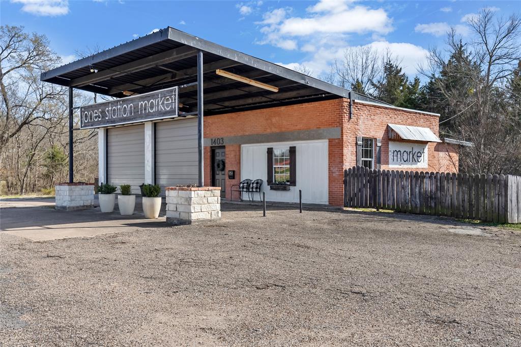 Step into a piece of Greenville history at 1403 E Interstate 30, formerly known as Jones Market Station. Originally built as a 1950s gas station, this distinctive property has been thoughtfully transformed into a charming, rustic venue filled with character, creativity, and opportunity.

Currently operating as a boutique event space hosting gatherings of 40+ guests, the property is ideal for private parties, showers, workshops, meetings, and community events. Inside, bright white walls, vintage-inspired details, and locally curated décor create a warm, inviting atmosphere that can easily adapt to a variety of event styles or business concepts.

The layout includes a kitchenette and dedicated serving area, allowing for seamless hosting, while the outdoor patio space provides additional room for guests to gather and enjoy the setting.

Beyond its current use, the property offers excellent potential for entrepreneurs and investors looking to bring a unique concept to Greenville. The space could easily transition into a boutique retail shop, coffee bar, creative studio, office space, or continued event venue, making it a versatile opportunity in a convenient location.

With its nostalgic charm, flexible layout, and business potential, this property presents a rare chance to own a truly one-of-a-kind space with both character and commercial possibilities.

History, charm, and opportunity - all ready for the next visionary owner!
