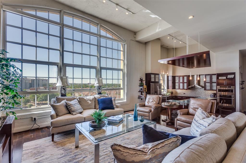 Luxury Loft Living at One Montgomery Plaza. Experience the perfect blend of historic charm and modern luxury in this stunning unit at One Montgomery Plaza. Design-forward features include soaring 16-foot ceilings, massive 12-inch-thick concrete exterior walls for superior sound insulation, and expansive windows that flood the space with natural light. Sleek sliding barn doors, Studio Collection hardwood flooring in the living areas, and spa-inspired bathrooms create a refined, contemporary aesthetic. The chef's kitchen is equipped with high-end GE Profile stainless steel appliances, offering both style and performance. This unit also includes two deeded side-by-side parking spaces (2195 & 2196) conveniently located in the West Tower Garage. Enjoy unmatched amenities in this resort-style community, including a luxury rooftop pool with private cabanas and spa, outdoor kitchens and grilling areas, putting green, media room, indoor lounge, fitness center, gated dog run, and 24-hour concierge with secured access. With daily public transit connecting Montgomery Plaza to Fort Worth’s vibrant Cultural and Entertainment Districts—and effortless access to I-30, I-35, and Hwy 121—your lifestyle will be as convenient as it is elevated. Discover the exceptional lifestyle of Montgomery Plaza—schedule your private tour today! Fridge, washer and dryer convey.