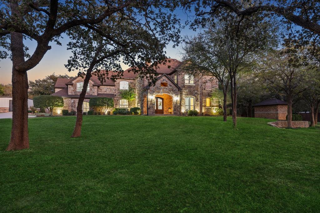 Feel miles away from the city on your private 2.5 acre gated estate property complete with stocked pond and 3,000 square foot climate-controlled garage - workshop. Parking for 10+! Entirely remodeled and expanded, the owners struck the perfect balance between luxury and comfort. Special features include: 1st floor media room; nail-down hardwood flooring; plantation shutters; vinyl windows; laundry both upstairs & down; tankless water heater; well sourced irrigation; RV storage. Unwind after a long day in your vast primary suite with a book by the fire or soak in the freestanding clawfoot tub of the spa-like bathroom with heated floors. Sharpen your cooking skills in the chef's kitchen showcasing a commercial range with pot filler. Rest under the shade of 1,200 square feet of covered outdoor living space or cool down in the oversized saltwater diving pool featuring slide, spa & grotto. New memories are ready to be made in this park-like setting that has hosted family weddings. No HOA!