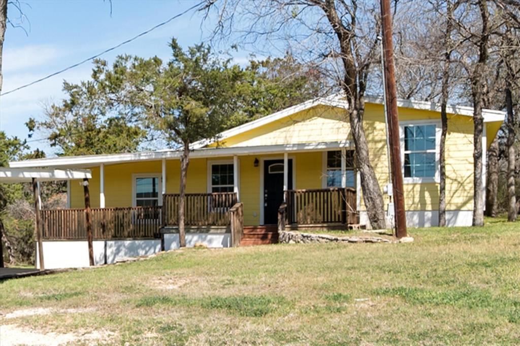 BOM due to buyer financing, appraisal was well above listing price! Do not miss this opportunity! Tucked beneath mature trees in Lake Country Acres, this charming cottage-style home offers peaceful living with room to grow. Situated on two lots, this 3-bedroom, 3-bathroom home combines character, functionality, and endless potential. Step onto the inviting covered front porch — arguably one of the best views around — where you’ll want to pull up a chair and stay awhile. Inside, you’ll find a thoughtfully designed layout featuring three full bathrooms, with two bedrooms offering private ensuite baths, ideal for guests or multigenerational living. The home is well maintained and features laminate flooring throughout and nice updates. Property includes two septic systems, offering flexibility for future additions or expansion. Property includes two septic systems, offering flexibility for future additions or expansion. Outside, a 2-car covered carport adds everyday convenience. If you’ve been looking for charm, space, and flexibility all wrapped into one peaceful setting, this Lake Country Acres gem is ready to welcome you home. Seller will consider owner financing with the right offer!