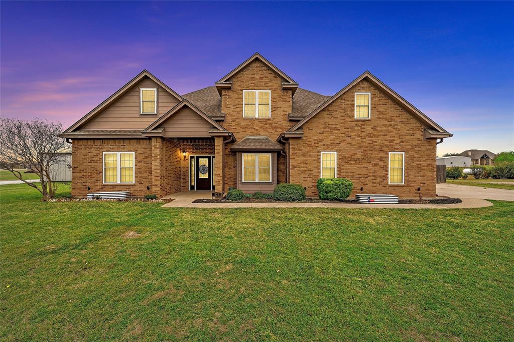 Welcome to your own slice of peaceful country living in the charming and laid-back community of West. Situated on 1.69 acres in the beautiful Quail Run Estates, this stunning property offers the perfect balance of quiet country charm and convenient access to town and IH-35.  With over 2,200 square feet of living space, this spacious home features 4 bedrooms, 2.5 bathrooms, a formal dining room, and a large family room with soaring ceilings and a cozy wood-burning fireplace. Abundant windows throughout fill the home with natural light, creating a warm and inviting atmosphere.
The kitchen is well-appointed with quartz countertops, stainless steel appliances, and direct access to the patio, making it perfect for morning coffee or casual dining.  The isolated primary suite on the main floor provides a relaxing retreat, featuring a large soaking tub, separate shower with subway tile, dual vanities, and an oversized walk-in closet.  Upstairs you’ll find three additional bedrooms along with a versatile bonus room, ideal for a home office, playroom, or flexible living space.  Step outside to enjoy a private fenced backyard complete with a 10' x 12' storage shed and greenhouse, offering plenty of room to relax, garden, or entertain.  Equestrian and hobby enthusiasts will especially appreciate the newly constructed barn (2025) featuring a full 200-amp electrical panel, LED bay lighting with switch, a new driveway to the barn, and new pipe pens with arena.  Located within the highly sought-after West ISD, this well-maintained property offers comfort, space, and country charm in one exceptional home.  Schedule your private showing today to experience everything this beautiful property has to offer.